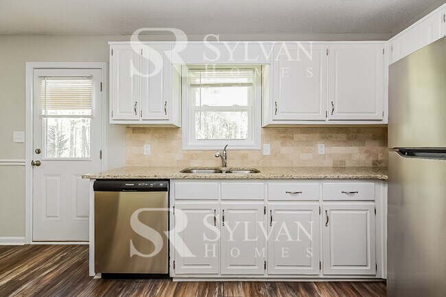 Building Photo - The living is easy in this 3 bedroom, 2 bathroom home