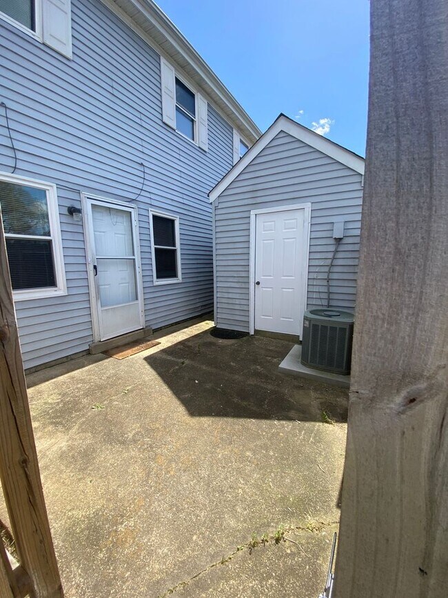 Primary Photo - Spacious Townhouse with Fenced Backyard