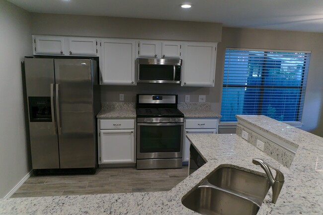 Kitchen with Granite and Stainless Appliances - 12905 Modena Trail