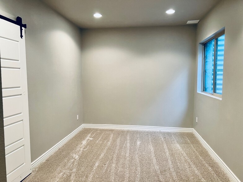 Basement bedroom with egress window. - 2317 Decatur St