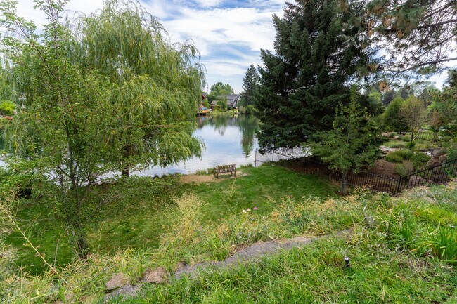 Building Photo - Private river access and stunning views from this home on Harmon Blvd! + Bonus Room