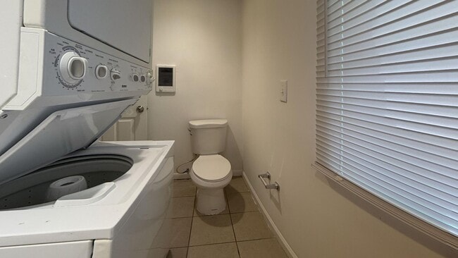 Building Photo - Charming 4BR/2BA Rowhouse with Hardwood-Style Flooring Throughout