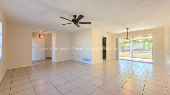Building Photo - SPACIOUS SARASOTA HOME WITH LARGE FENCED YARD! MOVE IN READY! ALL TILE/ NEW LVP!