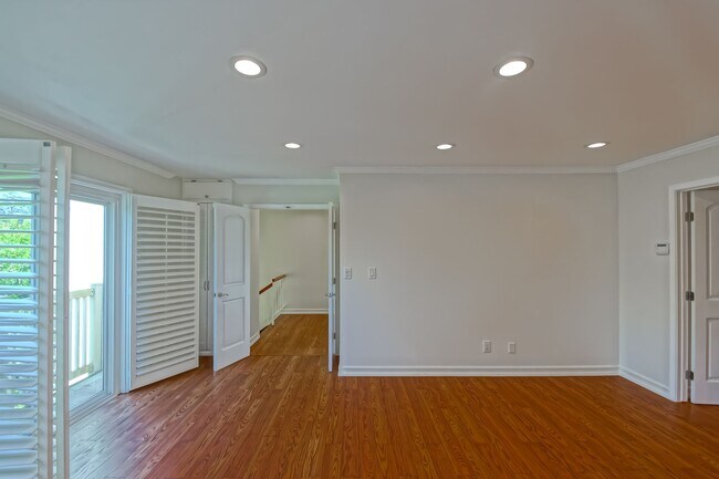 Building Photo - BRIGHT & AIRY, REAR-UNIT TOWNHOUSE W/ SPACIOUS PATIO, BALCONY & HUGE 2-CAR GARAGE IN GATED COMMUN...