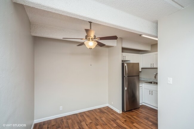 Dining area with a ceiling fan off the kitchen - 878 S Dexter
