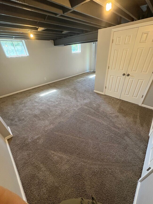 Building Photo - Spacious 4 Bed / 2.5 Bath Home on Nearly 3/4 Acre Lot with Walkout Basement and Multiple Living A...