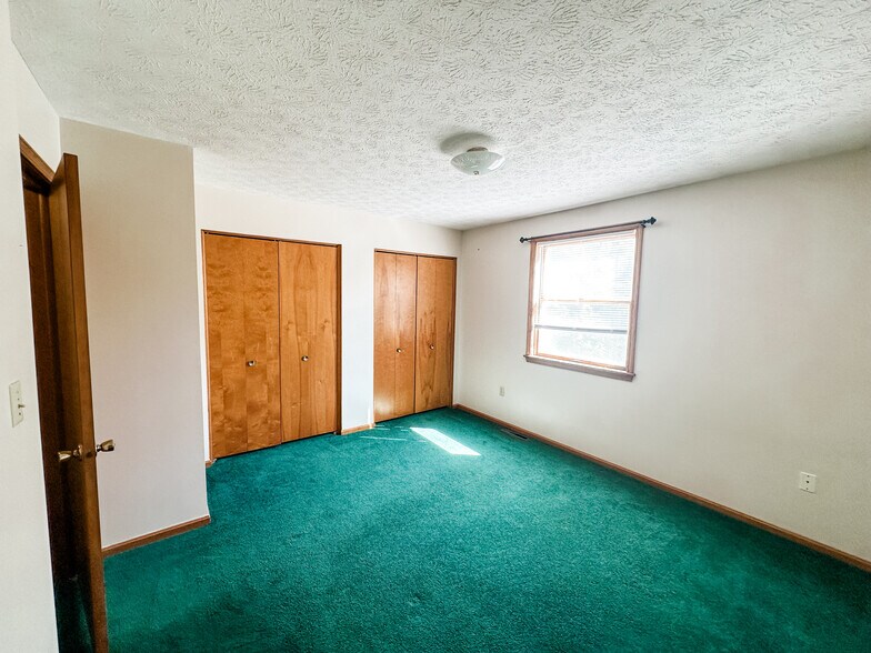 Two identical bedrooms, upstairs, both with two large closets - 5229 Rule Rd
