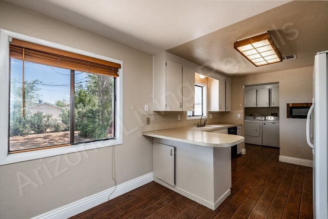 Building Photo - LARGE FENCED YARD WITH DETACHED GARAGE