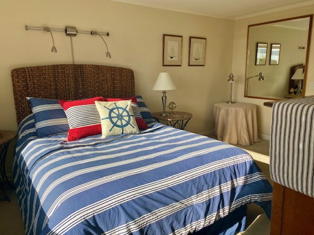 Master Bedroom with Large Mirror reflecting Lake into the room - 6620 Lake Washington Blvd NE