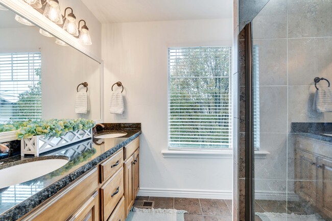 Master bathroom with double vanity, drawers and cupboards, and medicine cabinet - 10441 S Sage Vista Way