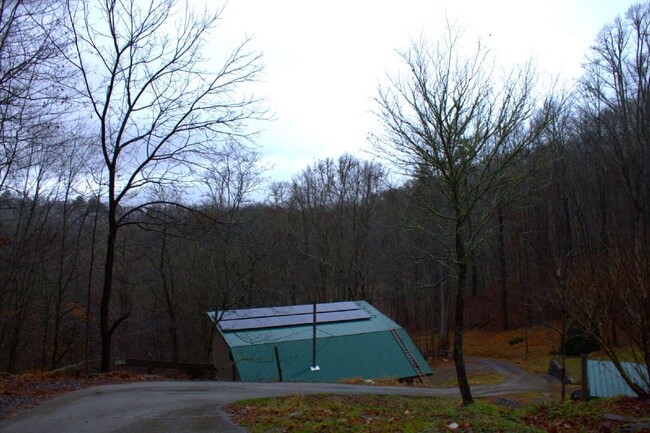 Building Photo - "Charming 2-Bed Retreat with Hardwood Elegance in Scenic Marshall, NC"