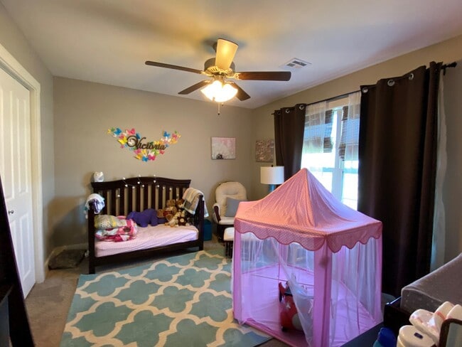 Building Photo - FENCED BACKYARD! BONUS ROOM/OFFICE! SAFE ROOM! THREE CAR GARAGE