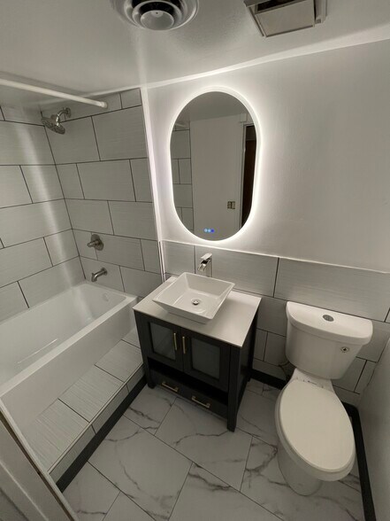 Remodeled bathroom with tub & Bluetooth LED mirror - 3708 W Dickens Ave