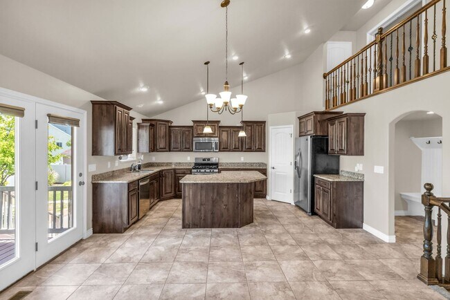 Building Photo - Spacious Syracuse Home with Covered Deck, Loft & Oversized 3-Car Garage
