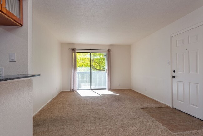 Building Photo - Light and Bright Second Level Condo Available Now!