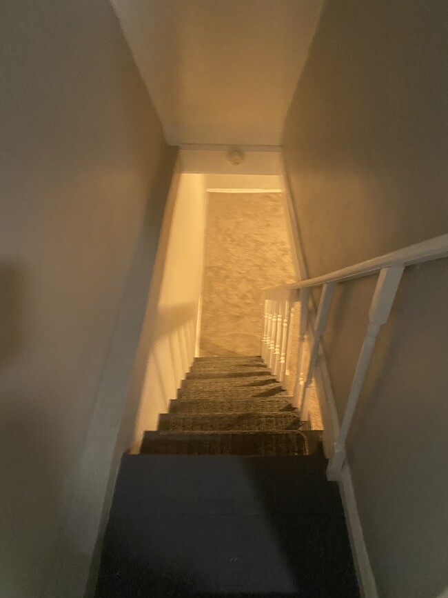 stairs to lower level - 606 N Woodington Rd