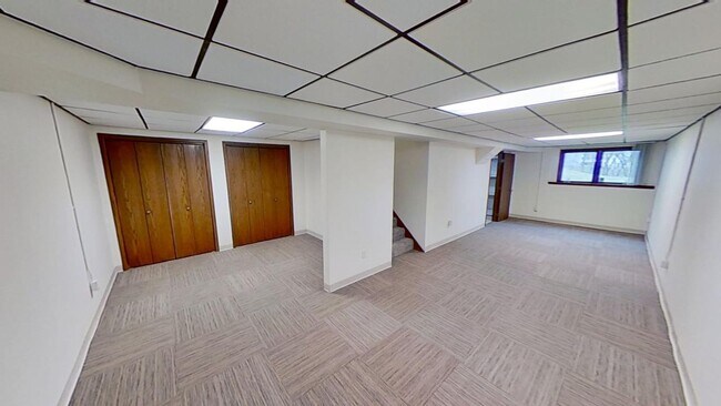 Building Photo - Updated 2BR/1BA duplex with office in partially finished basement, detached garage and across fro...