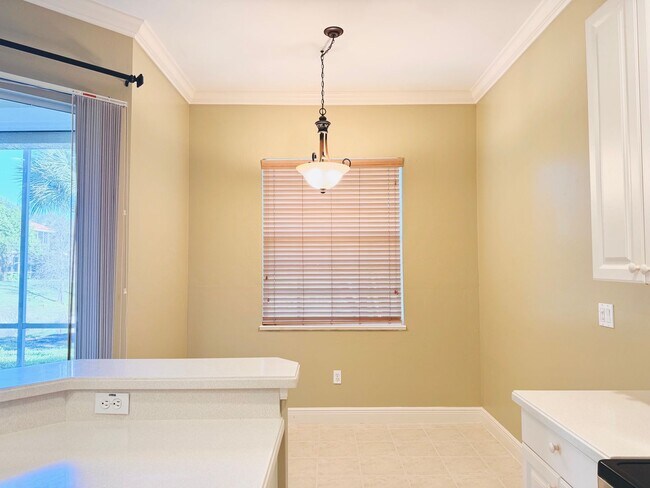 Building Photo - Experience Bell Tower Park. GATED ground floor 2 Bed 2 Bath Den 1 Car Garage Condo.