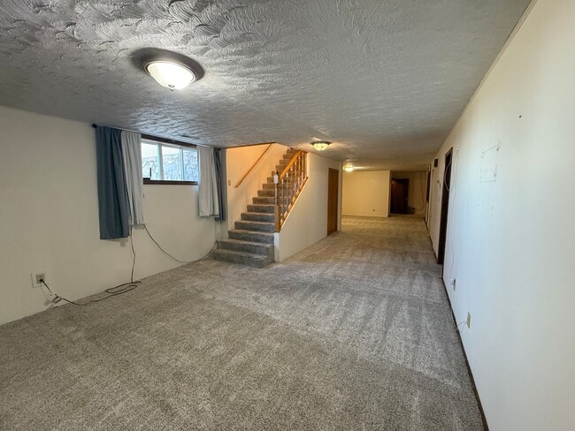 Building Photo - Spacious, four-bedroom, two-bathroom, coun...