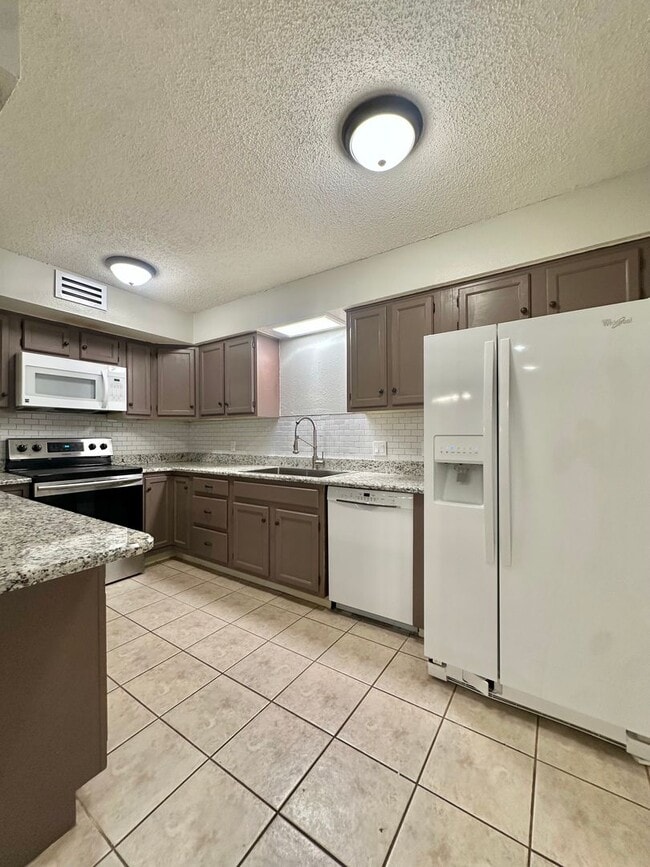 Building Photo - COMING MARCH 2026 - 2-Bedroom 2-Bathroom Condo + Clubhouse/Pool/River Access