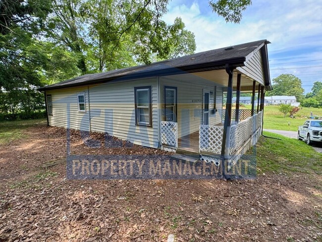 Building Photo - Two bedroom home w/ wrap-around porch!