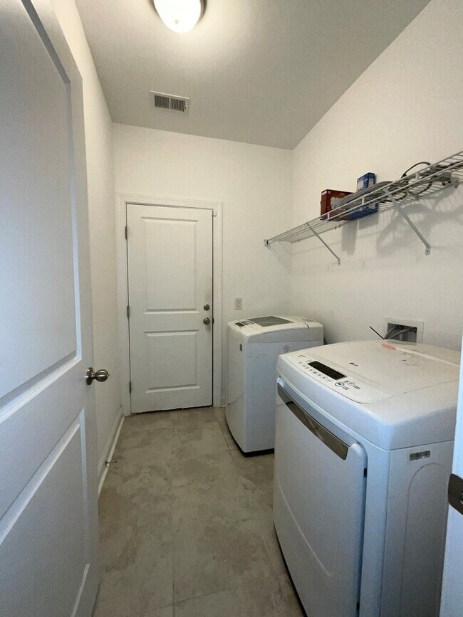 Building Photo - "Spacious 4-Bed Oasis with Stunning Lake V...