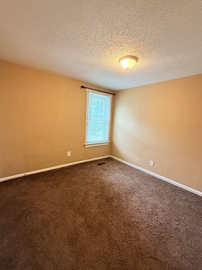 Building Photo - Now Available! Spacious 3 Bedroom on a Corner Lot