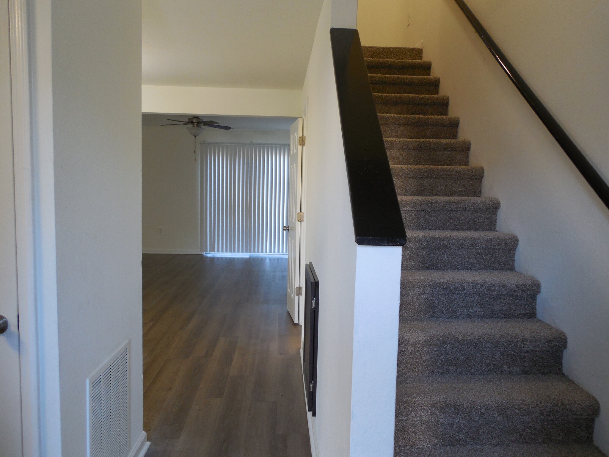 Looking from the front door - there is under stair storage and a sizable living/dining area - 1163 Fords Pointe Cir