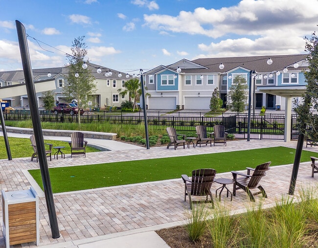 Cornhole lawn-Toss around some fun at the cornhole lawn with covered seating. - 2537 Arbor Wind