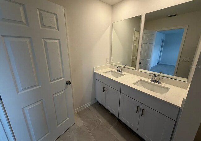 Building Photo - "Spacious 3-Bedroom Townhouse with Granite Elegance in St. Cloud – 4543 Rangeland Way"