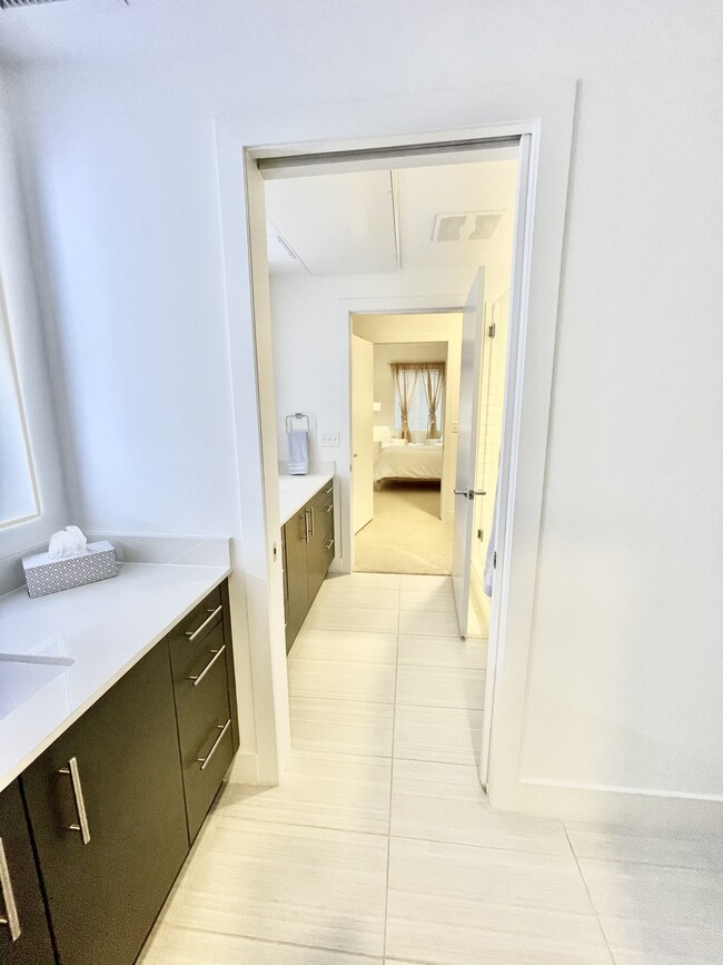 There are two luxury sink areas, and a sliding door that divides the bathroom in half, if needed. - 2530 Lawrence St