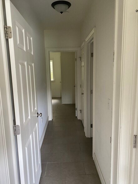Hallway to family room and full bathroom - 303 Landon Way
