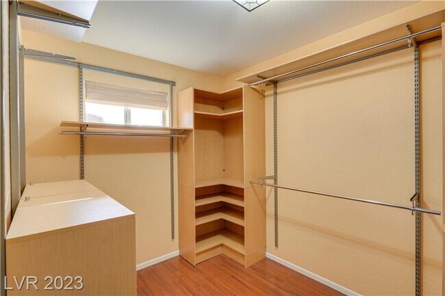 Building Photo - 4 BEDROOM HOME WITH PRIMARY BEDROOM DOWNST...