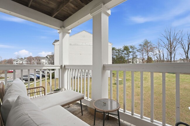 Building Photo - Bathed in natural light, this stunning second level condominium offers an effortless blend of com...