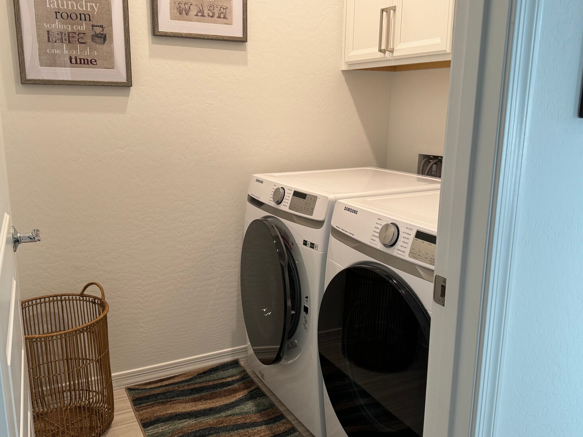Laundry Room with front loading washer and dryer - 9052 W Georgia Ave