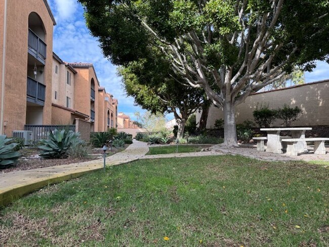 Building Photo - Resort-Style 2BR/2BA First-Floor Condo in Gated Lucera Community Near UTC