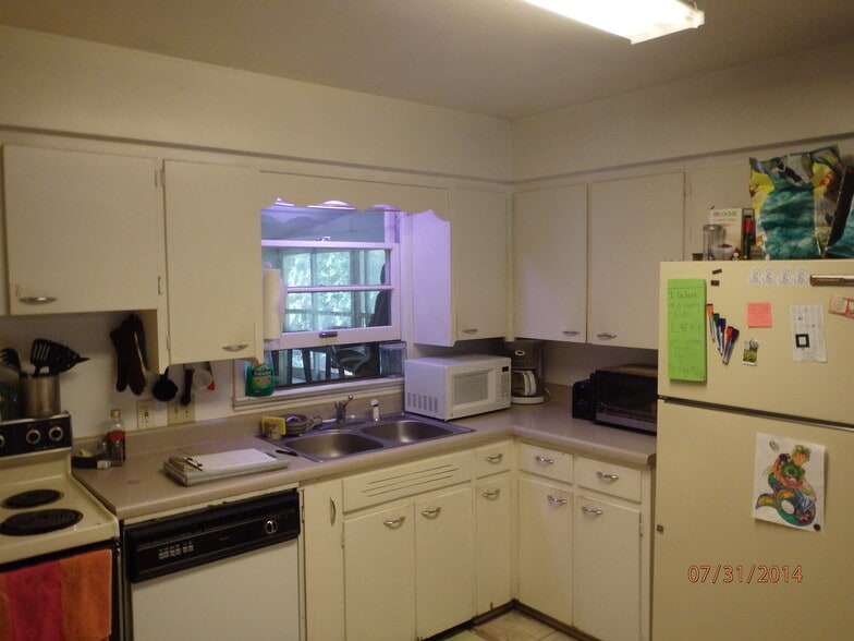 Kitchen w Tenants stuff, Newer Fridge has been installed - 609 W Lake St