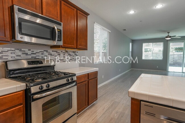 Building Photo - Questa Village: Spacious 3-Bedroom Retreat...