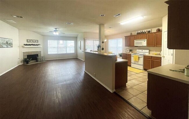 Building Photo - Plank Floors & Modern Comforts!" "Corner Fireplace, Split Bedrooms & a Master Retreat You’ll Love!"