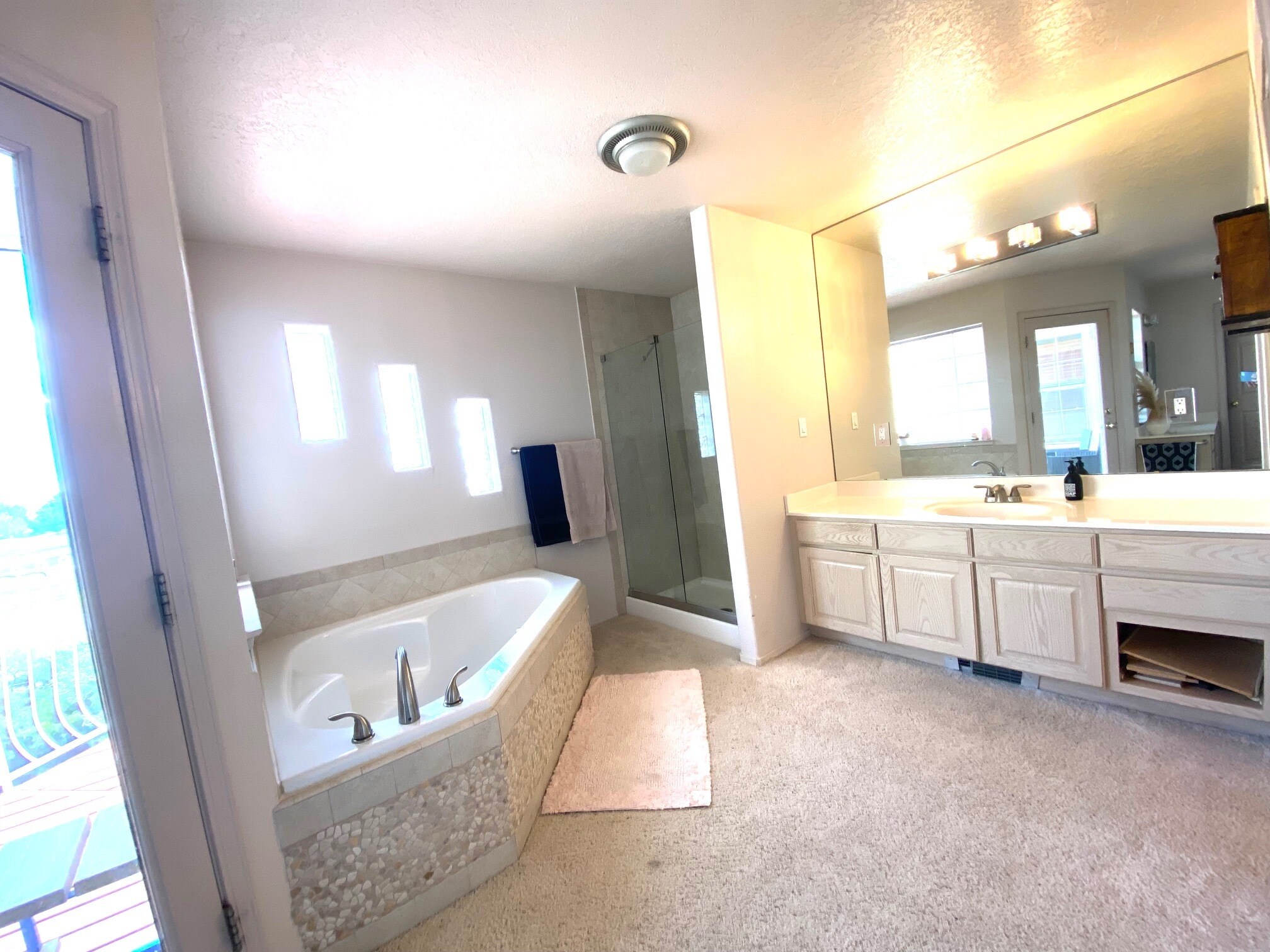 Master bath with walkin shower and spa tub. - 6424 Saint Josephs Ave NW