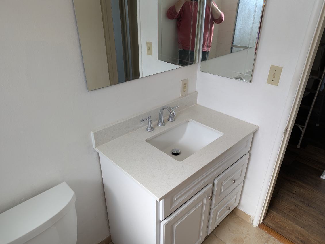 Bathroom sink and mirrors - 1311 Lyndon St