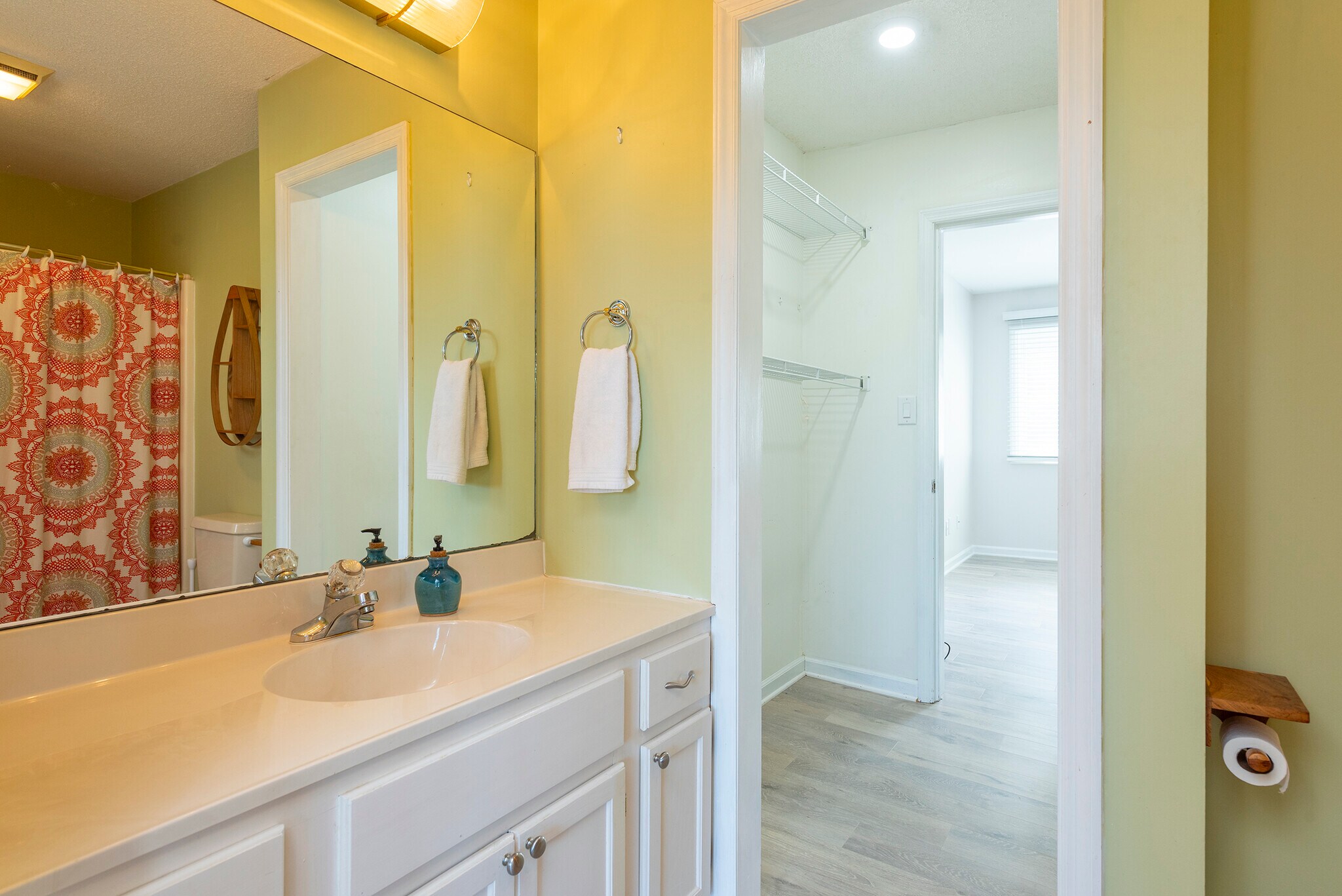 Charming main floor bathroom with fixtures and fresh, calming colors. - 405 Windswept Dr