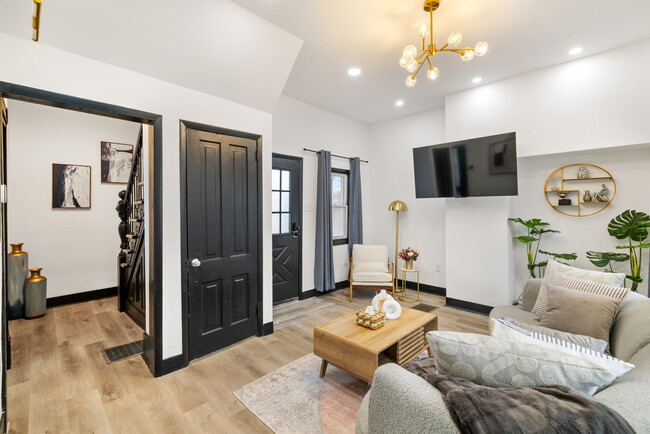 Living Room with Door to Basement and Hallway to Stairway - 10 Carrie St