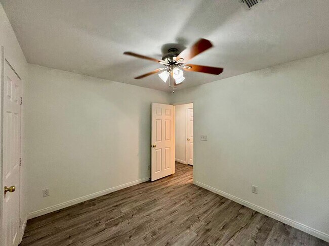 Building Photo - Welcome to this charming 4 bedroom, 2.5 bathroom home.