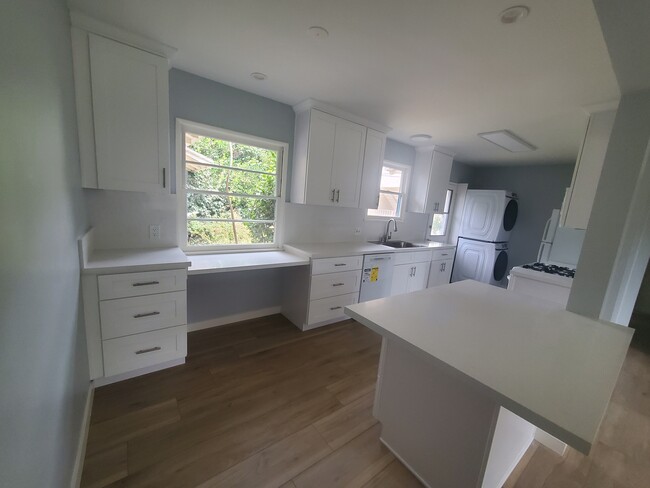 Kitchen has two windows facing backyard and one door to yard - 13525 Burbank Blvd