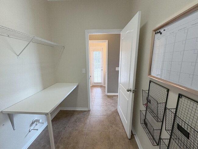 Building Photo - Spacious 5-Bedroom Pool Home with Putting ...