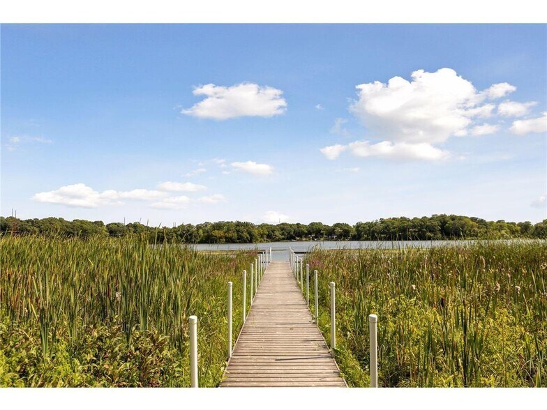 Stroll the boardwalk out to the community dock on Gleason Lake - 145 Holly Ln N