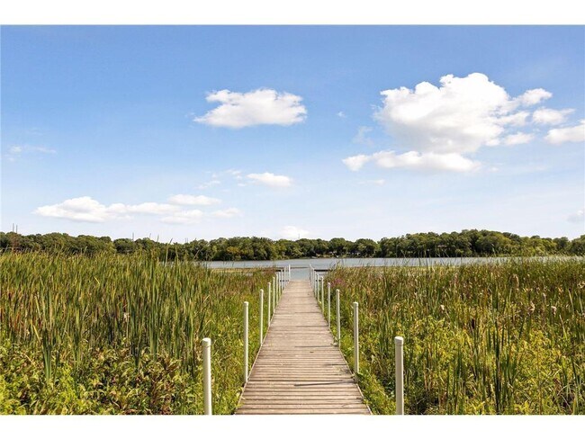 Stroll the boardwalk out to the community dock on Gleason Lake - 145 Holly Ln N