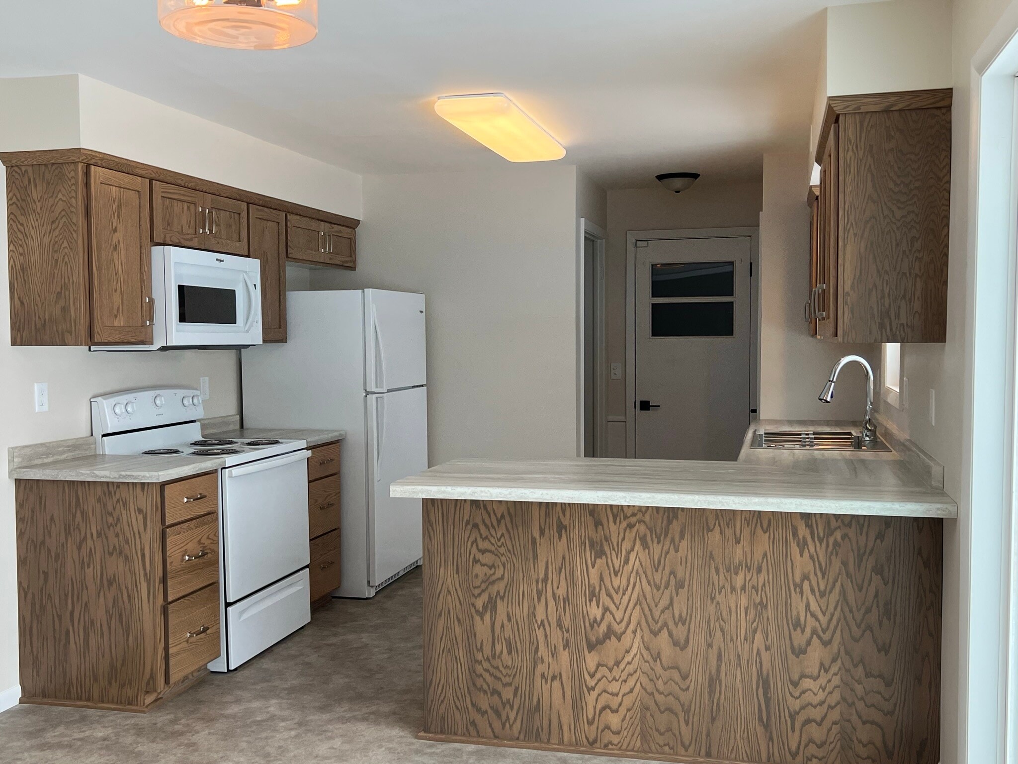 Kitchen with new appliances, cabinetry and flooring new in 2023 - 835 Maple St NE