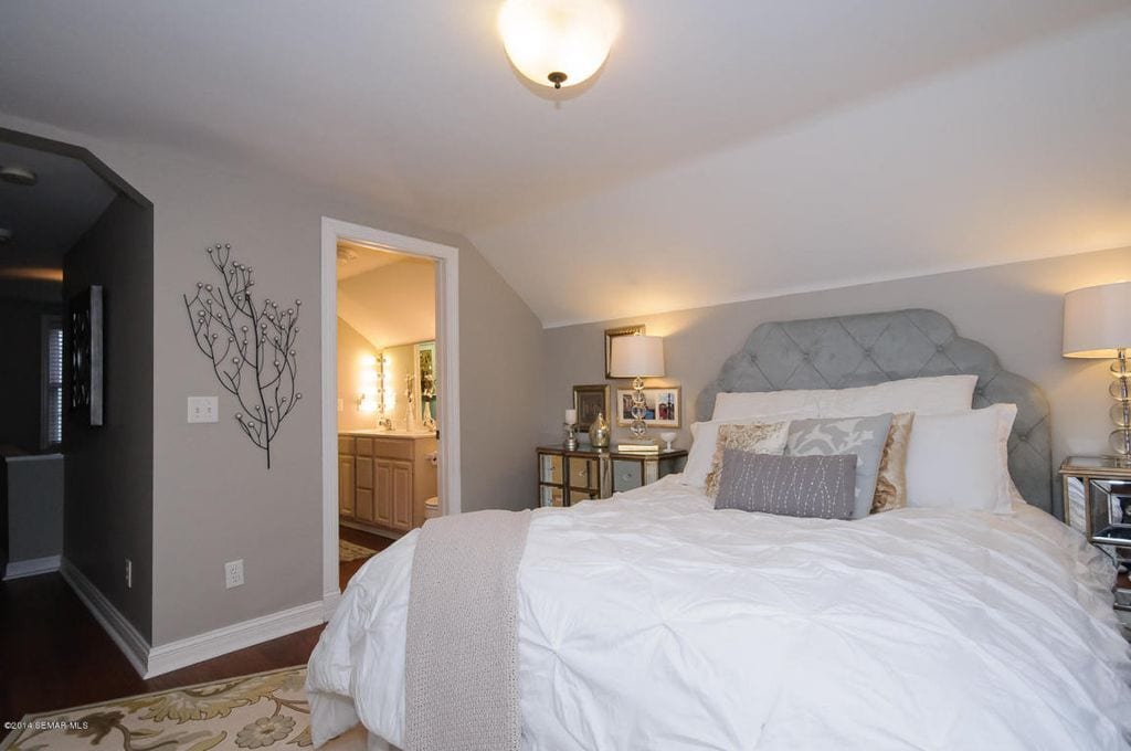 Upper level primary suite with attached full bath and walk-in closet - 728 12th Ave NE